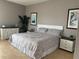 Comfortable bedroom with a queen-sized bed, neutral decor, and matching nightstands at 5300 S Atlantic Ave # 6-501, New Smyrna Beach, FL 32169