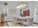 Elegant dining room with chandelier and modern table set at 733 Clifford Dr, Orlando, FL 32804