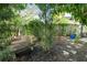 Landscaped garden with a stone bench and lush greenery at 733 Clifford Dr, Orlando, FL 32804