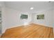 Bright bedroom featuring hardwood floors and large windows at 924 Beard Ave, Winter Park, FL 32789