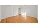 Simple bedroom with hardwood floors and mirrored closet doors at 924 Beard Ave, Winter Park, FL 32789