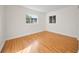 Well-lit bedroom with hardwood floors and dual windows at 924 Beard Ave, Winter Park, FL 32789