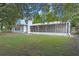 Ranch-style home with screened porch and large yard at 924 Beard Ave, Winter Park, FL 32789