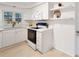 White kitchen features updated countertops and cabinetry at 924 Beard Ave, Winter Park, FL 32789