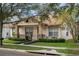 One-story home with mature trees and manicured lawn at 12953 Runswick Ave, Windermere, FL 34786