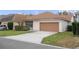 Attached garage with a large driveway at 12953 Runswick Ave, Windermere, FL 34786