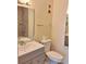 Modern bathroom with updated vanity, toilet, and shower-tub combination at 13103 Mulberry Park Dr # 817, Orlando, FL 32821