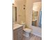 Modern bathroom with updated vanity, toilet, and shower-tub combination at 13103 Mulberry Park Dr # 817, Orlando, FL 32821