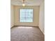 Bedroom featuring neutral carpeting, a ceiling fan, and bright natural lighting at 13103 Mulberry Park Dr # 817, Orlando, FL 32821