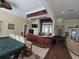 Community game room with pool table and wet bar at 13103 Mulberry Park Dr # 817, Orlando, FL 32821