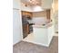 Cozy kitchen featuring stainless steel appliances and light wood cabinetry at 13103 Mulberry Park Dr # 817, Orlando, FL 32821