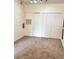 Spacious living room with ample closet space and neutral carpeting at 13103 Mulberry Park Dr # 817, Orlando, FL 32821