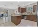 Modern kitchen with dark wood cabinets and granite counters at 1460 3Rd Ave, Deland, FL 32724