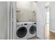 Laundry room with washer and dryer and built-in shelving at 1460 3Rd Ave, Deland, FL 32724