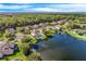 Community featuring a lake and numerous houses at 1601 Blue Grass Blvd, Deland, FL 32724