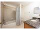 Bathroom with shower/tub combo and granite countertop at 1601 Blue Grass Blvd, Deland, FL 32724