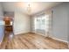 Bright dining room with wood floors and shiplap at 1601 Blue Grass Blvd, Deland, FL 32724