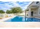 Inviting swimming pool with a water feature and patio area at 1601 Blue Grass Blvd, Deland, FL 32724