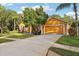 One-story house with attached garage and lush landscaping at 20575 Nettleton St, Orlando, FL 32833