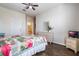 Bright bedroom featuring hardwood floors, ensuite bathroom, and flamingo themed decor at 2785 Almaton Loop # 305, Kissimmee, FL 34747