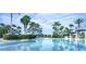 Gorgeous resort-style pool surrounded by lush landscaping and palm trees at 2785 Almaton Loop # 305, Kissimmee, FL 34747