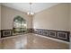Elegant dining room featuring stylish wainscoting, modern lighting, and beautiful floors at 2801 Ripton Ct, Orlando, FL 32835