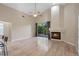 Bright living room with tile floors, a ceiling fan, fireplace, and sliding glass doors to the deck at 2801 Ripton Ct, Orlando, FL 32835