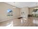 Bright, airy living room with tile floors, arched windows, and elegant double doors at 2801 Ripton Ct, Orlando, FL 32835