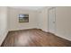 Bedroom with dark laminate wood flooring at 3629 Peaceful Pl, Orlando, FL 32810