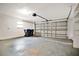 Garage with automatic door opener and shelving at 3629 Peaceful Pl, Orlando, FL 32810