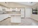 White kitchen with island and stainless steel appliances at 3629 Peaceful Pl, Orlando, FL 32810