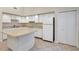 Modern kitchen with white cabinets and an island at 3629 Peaceful Pl, Orlando, FL 32810