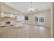 Kitchen with island, white cabinets, and tile flooring at 3629 Peaceful Pl, Orlando, FL 32810