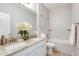 Bathroom featuring double sinks, granite countertops, and a shower-tub combo at 0 Paddock St, Orlando, FL 32833