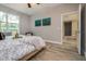 Bright bedroom with wood floors, large window, and neutral walls at 0 Paddock St, Orlando, FL 32833