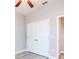 Bright bedroom featuring a ceiling fan and a closet with white doors at 0 Paddock St, Orlando, FL 32833