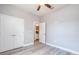 Bedroom featuring an ensuite bathroom, a closet, and a ceiling fan at 0 Paddock St, Orlando, FL 32833