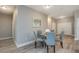 Cozy dining area featuring modern decor with hardwood floors, and easy access to the kitchen and living room at 0 Paddock St, Orlando, FL 32833