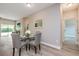 Cozy dining area featuring modern decor with hardwood floors, and easy access to the kitchen and living room at 0 Paddock St, Orlando, FL 32833