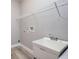 Laundry room featuring a sink, gray walls, and white trim at 0 Paddock St, Orlando, FL 32833