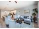 Open-concept living area with modern furnishings, a kitchen island, and plenty of natural light at 0 Paddock St, Orlando, FL 32833
