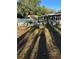 Spacious backyard deck with lattice-style railings and surrounding trees at 12680 Sw 98Th St, Dunnellon, FL 34432
