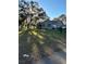 Single-story home with a large front yard and mature trees at 12680 Sw 98Th St, Dunnellon, FL 34432