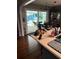 Modern kitchen with island, stainless steel appliances, and access to pool at 12680 Sw 98Th St, Dunnellon, FL 34432