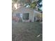 Tan metal workshop with double doors, housing various tools and equipment at 12680 Sw 98Th St, Dunnellon, FL 34432
