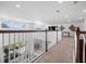 Upstairs hallway overlooking the living room at 1435 Myrtle Oaks Trl, Oviedo, FL 32765