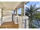 Gorgeous balcony featuring stylish architecture, a view of palm trees, and a wrought iron railing at 16659 Broadwater Ave, Winter Garden, FL 34787