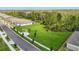 A vast green backyard is showcased, bordered by trees and neighboring homes at 2479 Pine Preserve Ct, St Cloud, FL 34771