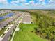 Aerial view of the neighborhood homes with a sprawling green space at 2479 Pine Preserve Ct, St Cloud, FL 34771