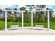 Tranquil backyard featuring a pergola swing, perfect for relaxation and enjoying the outdoors at 2479 Pine Preserve Ct, St Cloud, FL 34771
